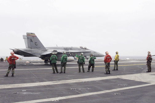 Marines from VMFA-312 prepare an F/A-18 Hornet for flight aboard the USS Harry S. Truman (CVN-75). Photo by: Courtesy: VMFA-312