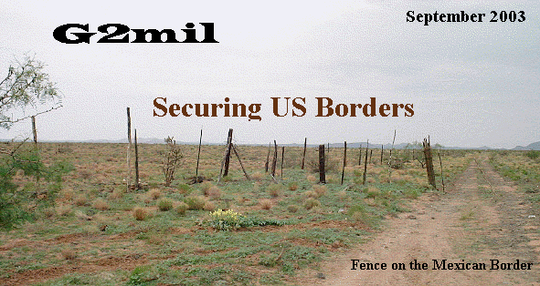 barbed wire fence and track along the U.S./Mexico border (8/08 9:51am)