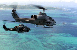 Two AH-1W Super Cobra helicopters from Marine Medium Light Attack Helicopter Squadron-367 make history as they proceed along the coastline of Okinawa, Japan, to complete 40,000 mishap-free flight hours Sept. 1.  
'Scarface,' as the unit is called, is based at Camp Pendelton, Calif., and is on Okinawa for a six-month deployment as part of the Unit Deployment Program.  The program allows units based in the United States to rotate through Okinawa to further their training here and with other nations in the region. Photo by: Staff Sgt. Jason M. Webb